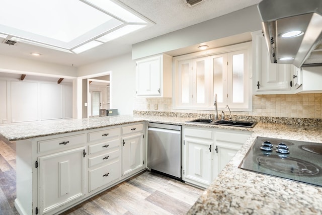 kitchen featuring kitchen peninsula, light wood-type flooring, stainless steel dishwasher, black electric cooktop, and white cabinets