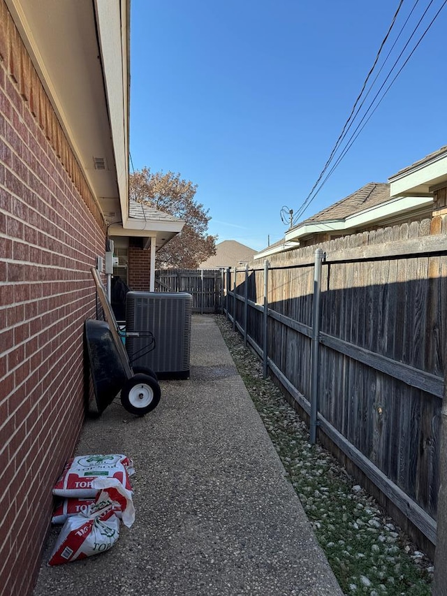 view of yard featuring central air condition unit