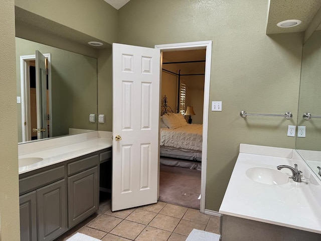 bathroom with vanity and tile patterned floors