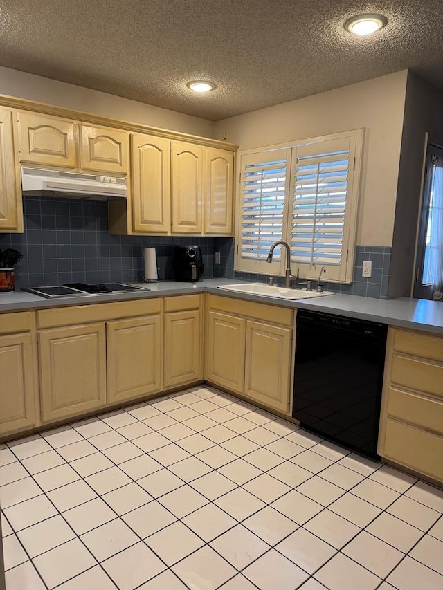 kitchen with light tile patterned flooring, light brown cabinetry, sink, decorative backsplash, and black appliances