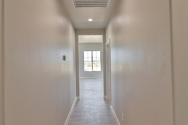 corridor with visible vents and baseboards