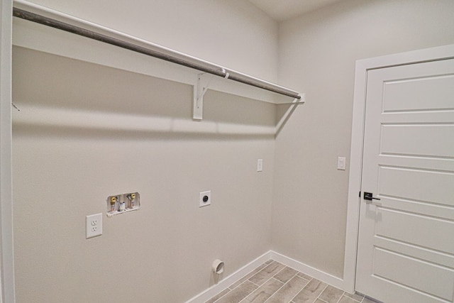 laundry room featuring hookup for a washing machine, laundry area, wood finish floors, baseboards, and electric dryer hookup