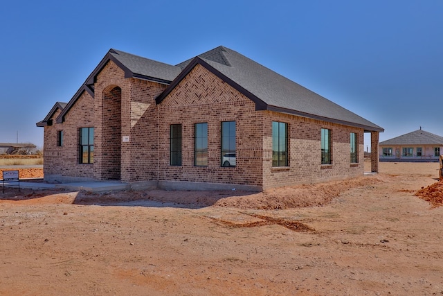 view of home's exterior featuring brick siding