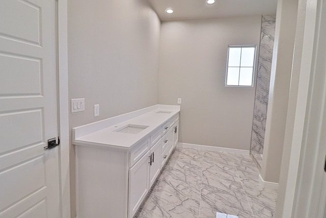 full bathroom with a shower, marble finish floor, recessed lighting, a sink, and baseboards