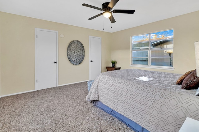 bedroom featuring ceiling fan, carpet flooring, and baseboards