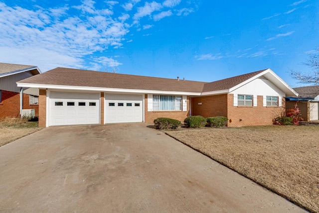 ranch-style house featuring a front yard and a garage