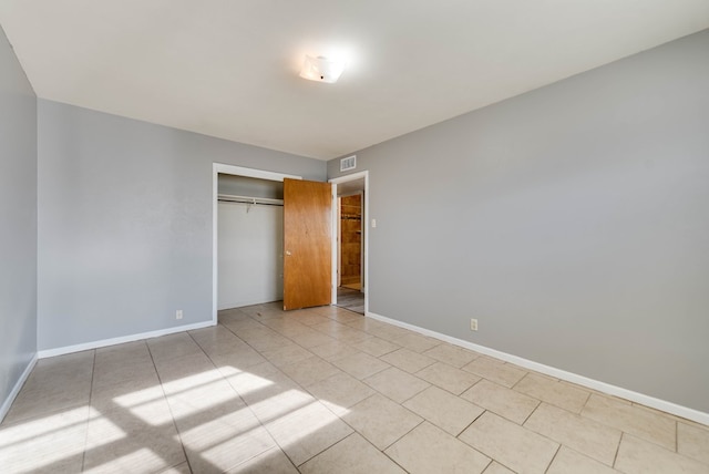 unfurnished bedroom with a closet