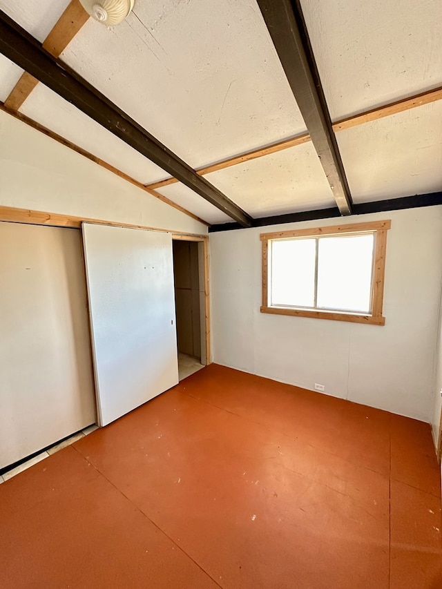 interior space with vaulted ceiling with beams