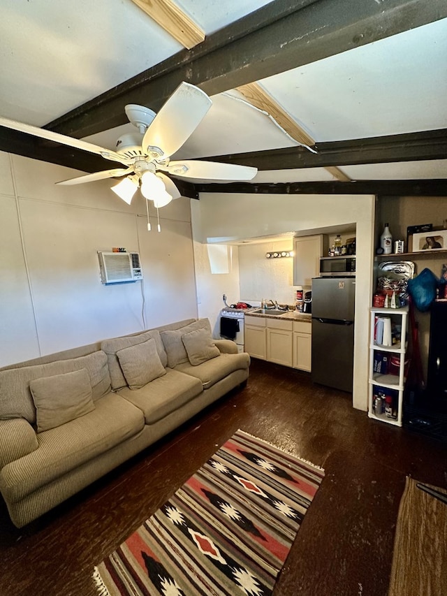 living room with dark wood-type flooring, sink, vaulted ceiling with beams, ceiling fan, and a wall unit AC