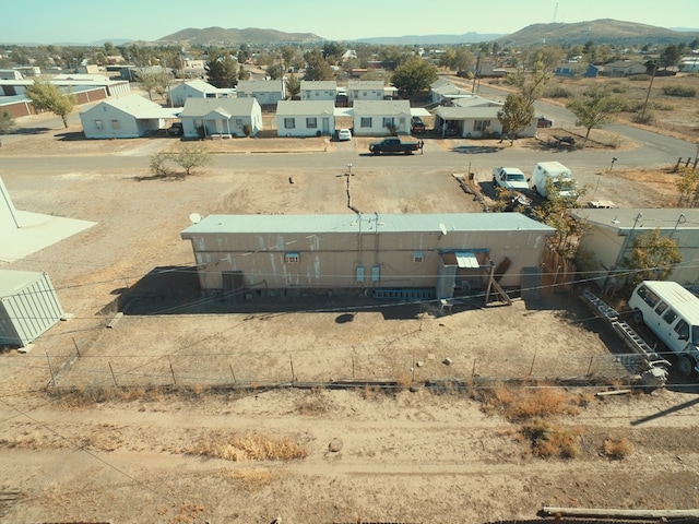 birds eye view of property featuring a mountain view