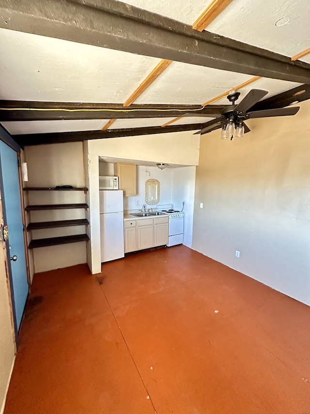 interior space with ceiling fan, sink, and lofted ceiling with beams