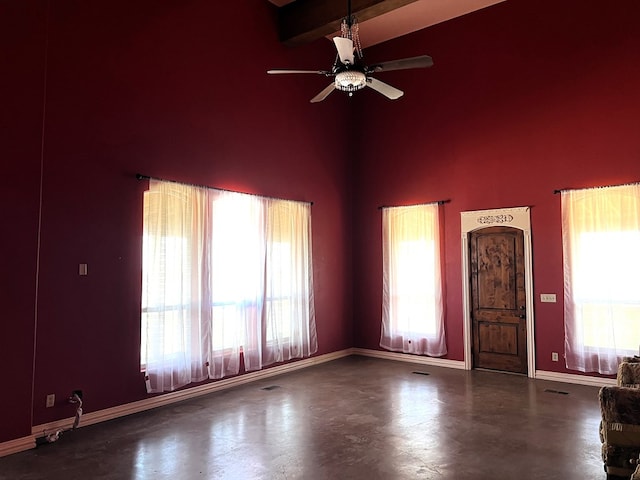 interior space featuring beamed ceiling, ceiling fan, and high vaulted ceiling