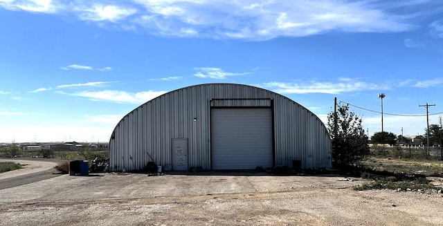 view of outbuilding featuring a garage