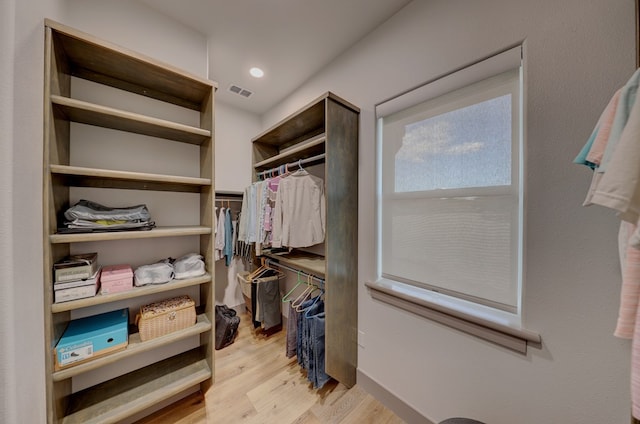 walk in closet featuring light hardwood / wood-style floors