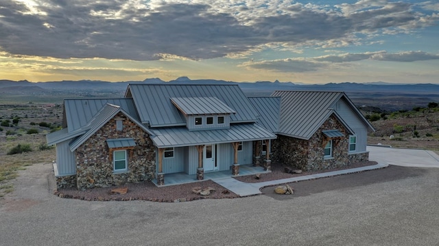 view of front of property featuring a mountain view and a porch