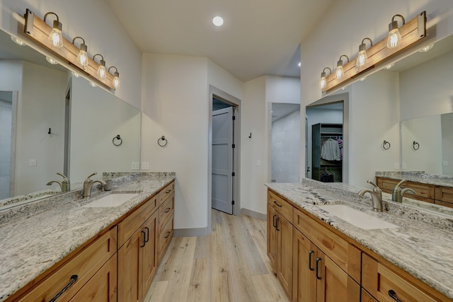 bathroom with vanity and hardwood / wood-style flooring