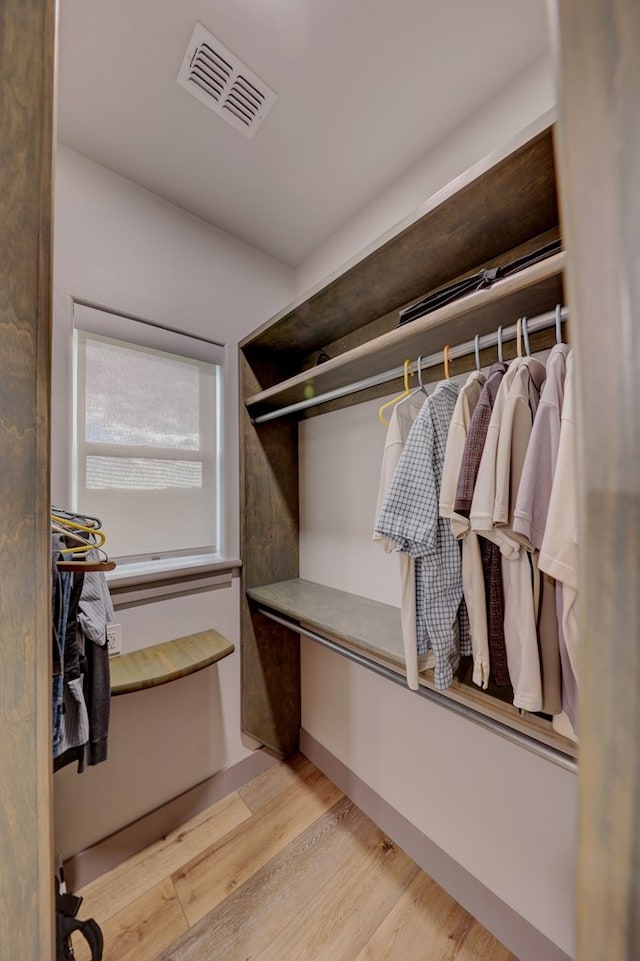 spacious closet featuring light hardwood / wood-style floors