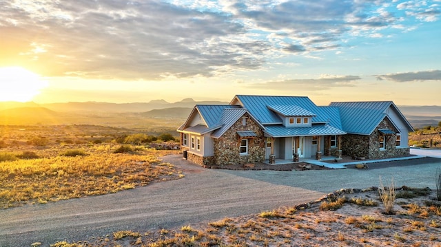 view of front of house featuring a mountain view and covered porch