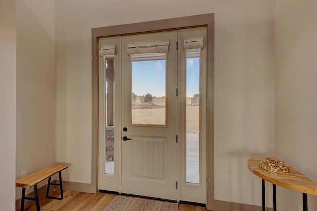 doorway to outside with light hardwood / wood-style flooring