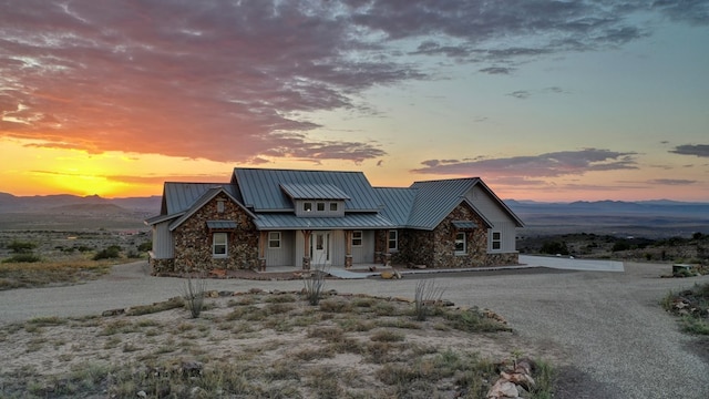 view of front facade featuring a mountain view and a porch