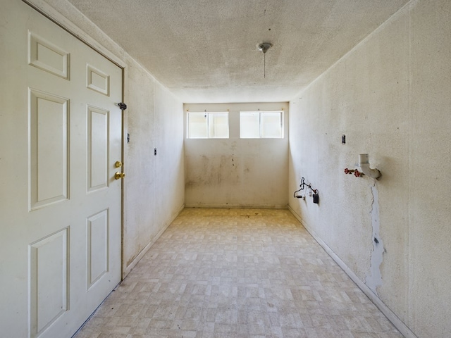 empty room featuring a textured ceiling