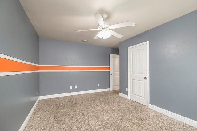 unfurnished room with carpet floors and ceiling fan