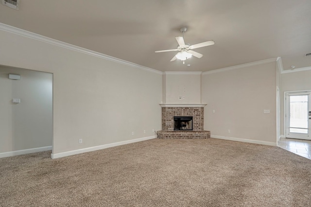 unfurnished living room featuring light carpet, a brick fireplace, ceiling fan, and ornamental molding