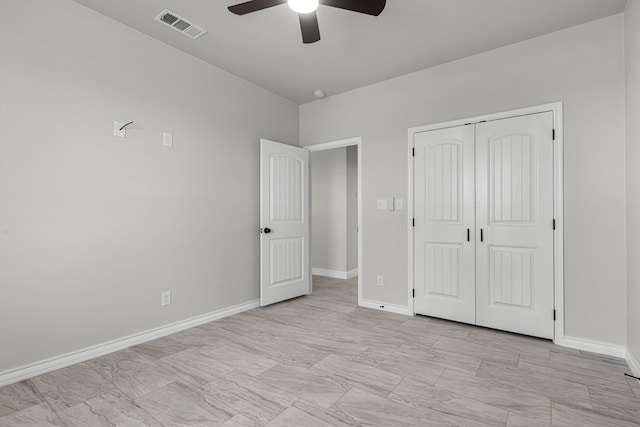 unfurnished bedroom featuring a closet and ceiling fan