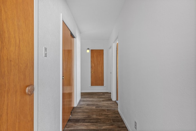 hall with dark wood-type flooring