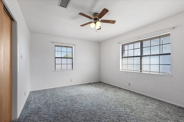 carpeted empty room with ceiling fan