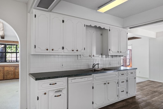 kitchen featuring backsplash, white cabinets, dark wood-type flooring, sink, and dishwasher