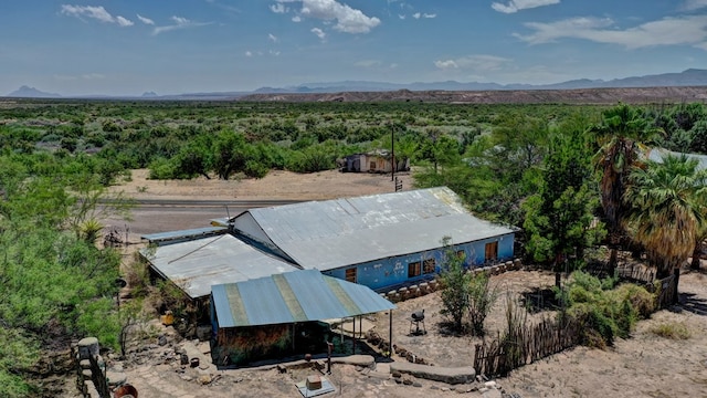 birds eye view of property with a mountain view