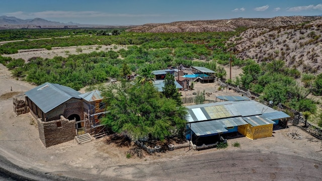 birds eye view of property featuring a mountain view