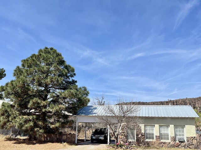 exterior space with a carport