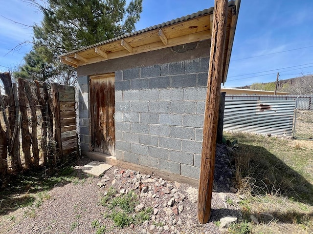 view of home's exterior with an outdoor structure