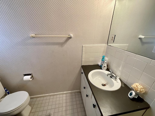 bathroom with vanity and toilet