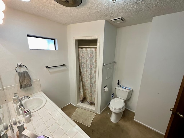 bathroom with a shower with curtain, sink, a textured ceiling, and toilet