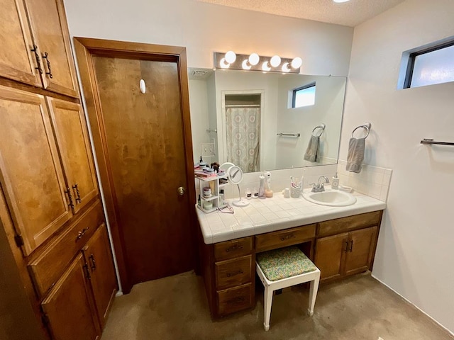 bathroom featuring vanity and a textured ceiling