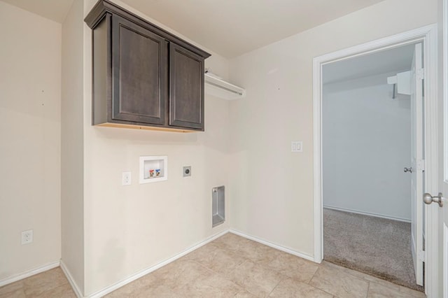 clothes washing area featuring cabinets, washer hookup, and hookup for an electric dryer