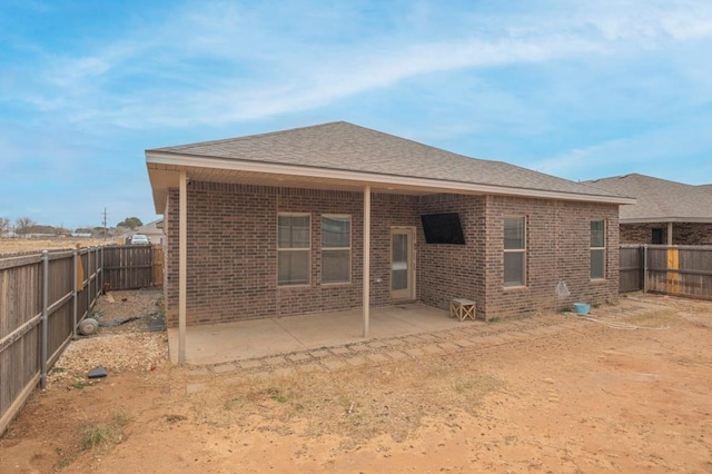 back of house with a patio