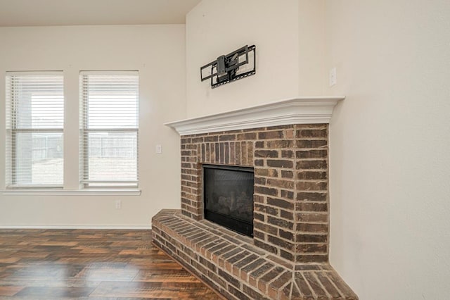 room details with a fireplace and hardwood / wood-style floors