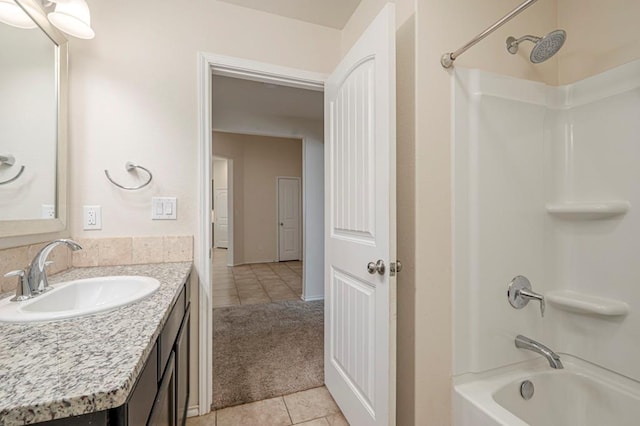 bathroom featuring vanity, tile patterned floors, and shower / bathtub combination