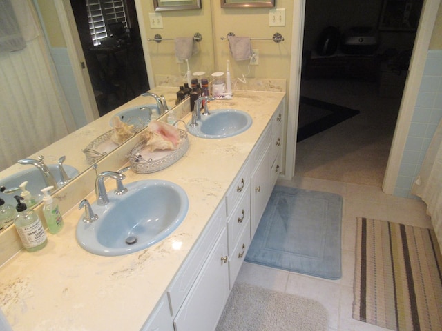 bathroom featuring tile patterned floors and vanity