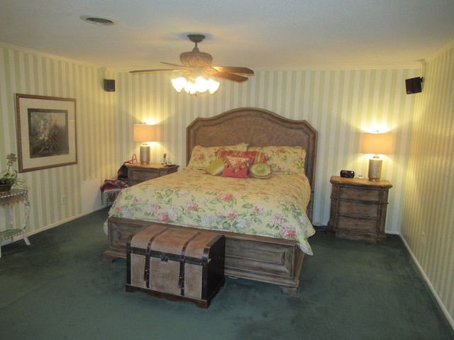 bedroom featuring dark colored carpet and ceiling fan