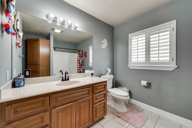 bathroom with a shower with curtain, tile patterned flooring, vanity, and toilet