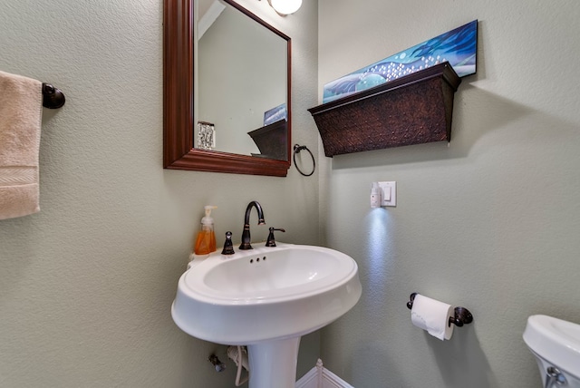 bathroom with toilet and sink