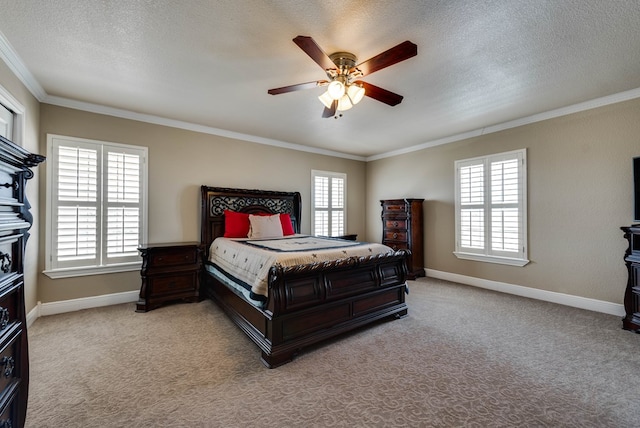 carpeted bedroom with multiple windows, ceiling fan, crown molding, and a textured ceiling