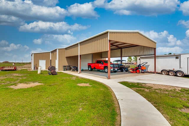 view of vehicle parking featuring a lawn