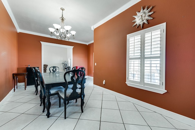 dining space with an inviting chandelier, light tile patterned floors, and ornamental molding