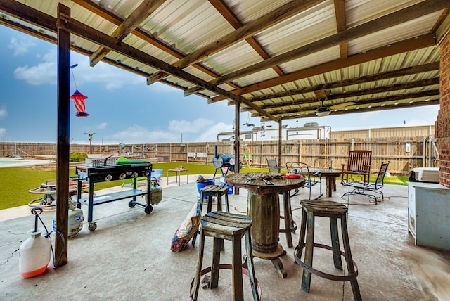 view of patio featuring ceiling fan